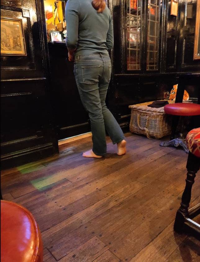 barefoot woman at bar